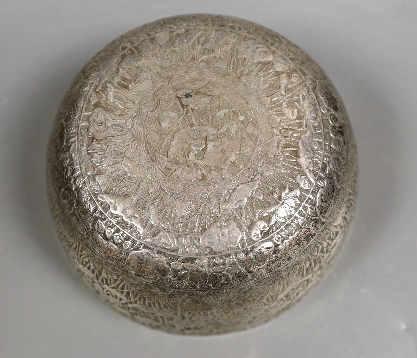 An Eastern embossed white metal bowl, diameter 17.7cm, 9.4oz.